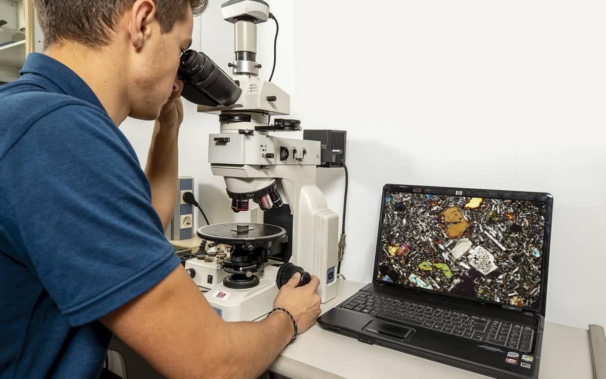 Senior engineer reviewing laboratory measurements and technical report