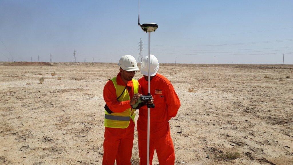 Geologists reviewing subsurface data